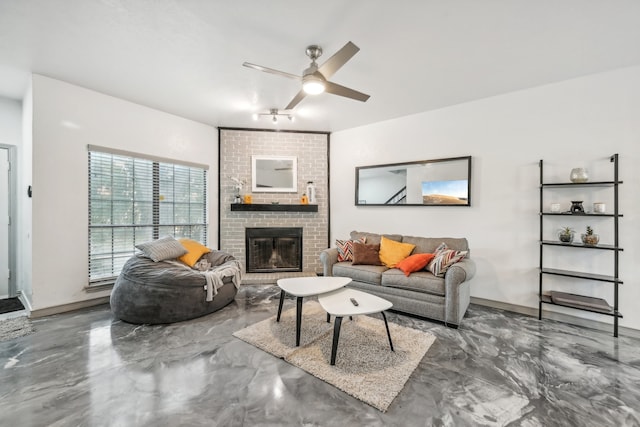 living room featuring a fireplace, concrete flooring, and ceiling fan