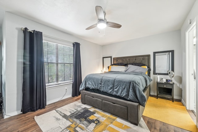 bedroom featuring hardwood / wood-style flooring and ceiling fan