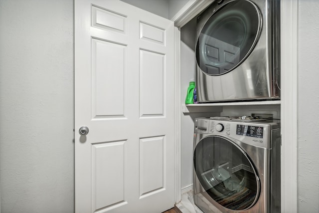 laundry room featuring stacked washer / dryer