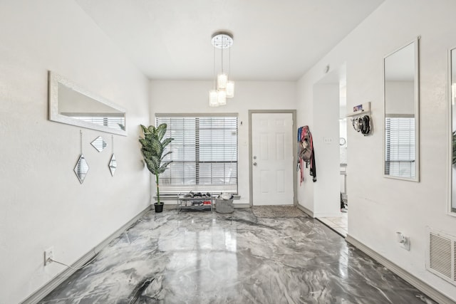 entrance foyer featuring concrete floors