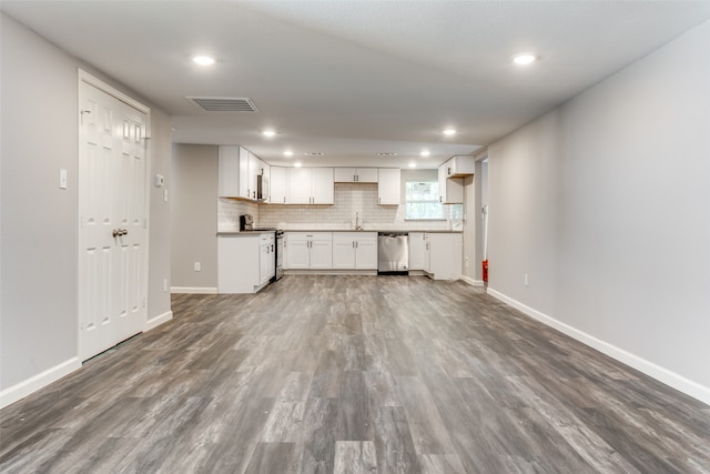 kitchen with backsplash, dark hardwood / wood-style flooring, white cabinetry, and stainless steel appliances