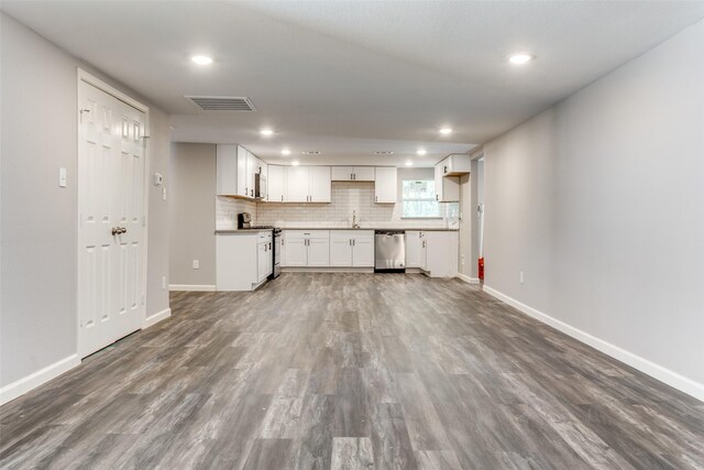 6614 Parkdale Dr, Dallas, TX 75227 - kitchen with stainless steel appliances, recessed lighting, dark wood finished floors, baseboards, and tasteful backsplash