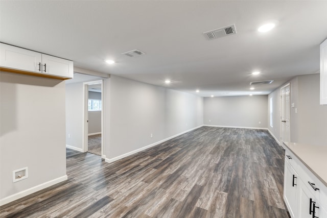 basement featuring dark hardwood / wood-style floors