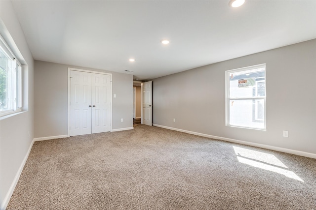 6614 Parkdale Dr, Dallas, TX 75227 - unfurnished bedroom featuring multiple windows, carpet, recessed lighting, and baseboards
