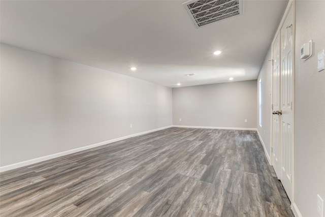 spare room featuring dark hardwood / wood-style floors