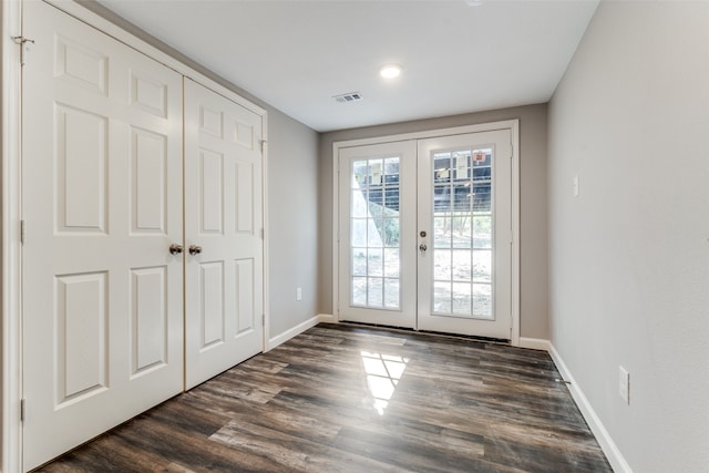 entryway featuring dark hardwood / wood-style flooring and french doors