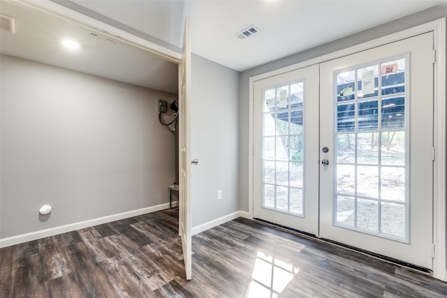 entryway with dark hardwood / wood-style flooring and french doors