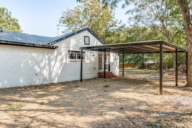 exterior space featuring a carport