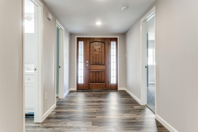6614 Parkdale Dr, Dallas, TX 75227 - foyer featuring dark wood finished floors and baseboards