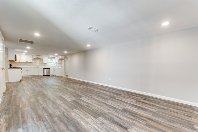 unfurnished living room featuring light hardwood / wood-style floors