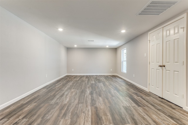 spare room with dark hardwood / wood-style flooring