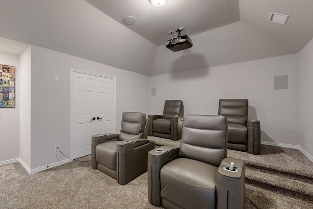 cinema featuring light carpet and lofted ceiling