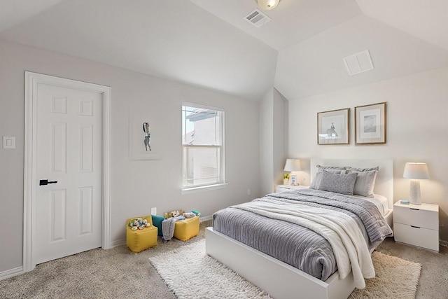 carpeted bedroom featuring vaulted ceiling