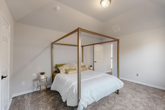 bedroom featuring carpet and lofted ceiling