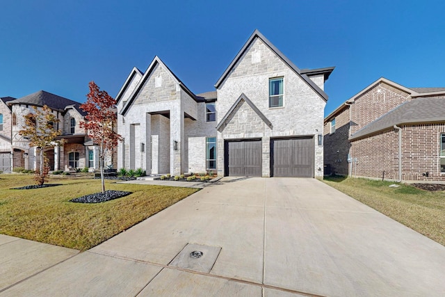 view of front of house featuring a garage and a front yard