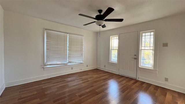 entryway with ceiling fan and dark hardwood / wood-style flooring