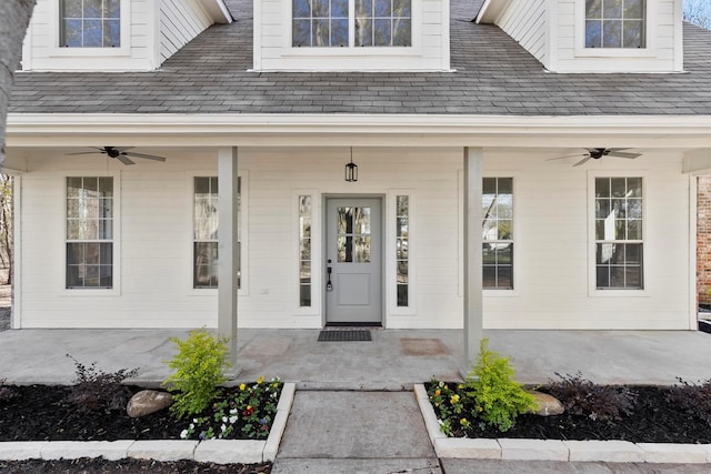 property entrance with ceiling fan and a porch