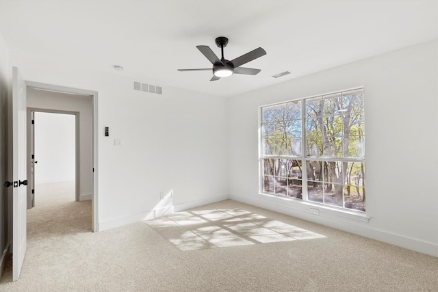 carpeted empty room with ceiling fan