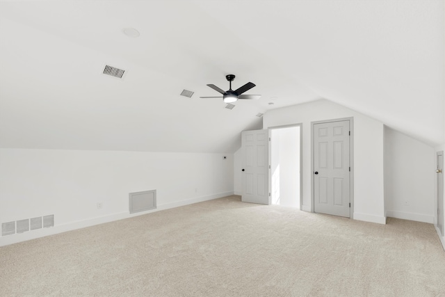 bonus room featuring ceiling fan, light colored carpet, and vaulted ceiling