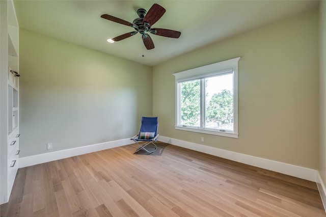 spare room with ceiling fan and light hardwood / wood-style flooring