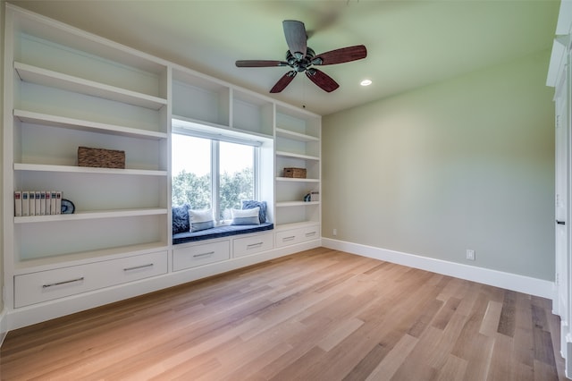 unfurnished living room with ceiling fan and light hardwood / wood-style floors