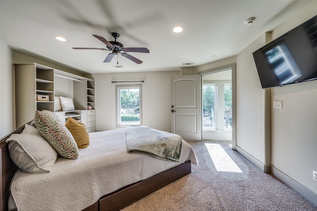 bedroom featuring ceiling fan and carpet