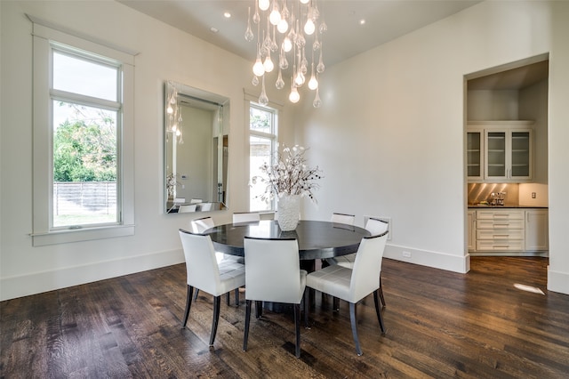 dining space with dark hardwood / wood-style floors