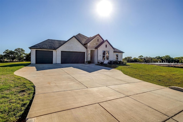 view of front facade with a garage and a front yard