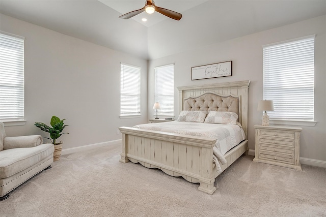 carpeted bedroom with ceiling fan and lofted ceiling