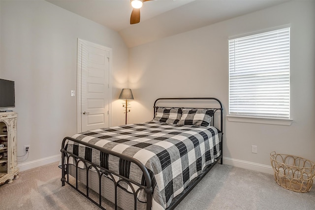 carpeted bedroom featuring ceiling fan and vaulted ceiling