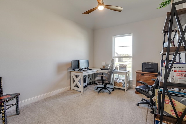 carpeted office with ceiling fan