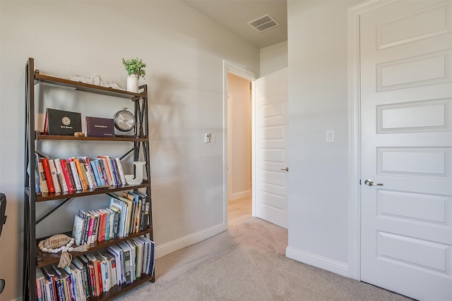 hallway with light carpet