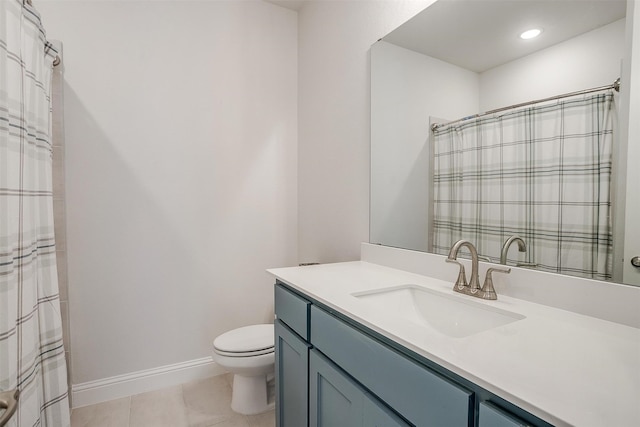 bathroom with tile patterned floors, vanity, and toilet