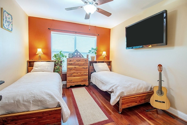 bedroom featuring ceiling fan and dark hardwood / wood-style flooring