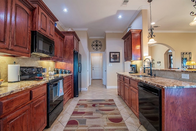 kitchen featuring pendant lighting, black appliances, crown molding, light tile patterned flooring, and sink