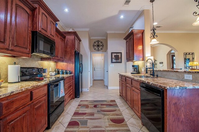 kitchen featuring pendant lighting, black appliances, crown molding, light tile patterned flooring, and sink