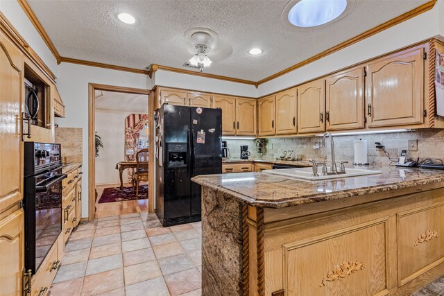 kitchen featuring black appliances, light stone countertops, kitchen peninsula, and a textured ceiling