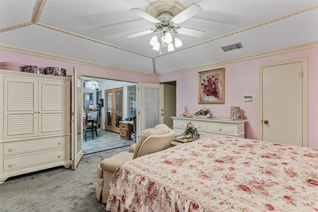 bedroom featuring french doors, a textured ceiling, light colored carpet, vaulted ceiling, and ceiling fan