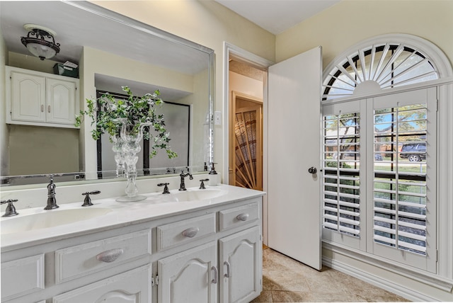 bathroom with vanity and tile patterned floors