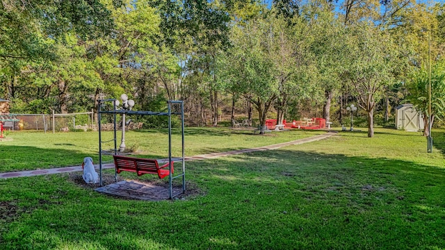 view of home's community featuring a yard and a shed