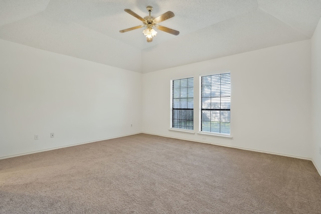 unfurnished room featuring carpet flooring, ceiling fan, a textured ceiling, and lofted ceiling