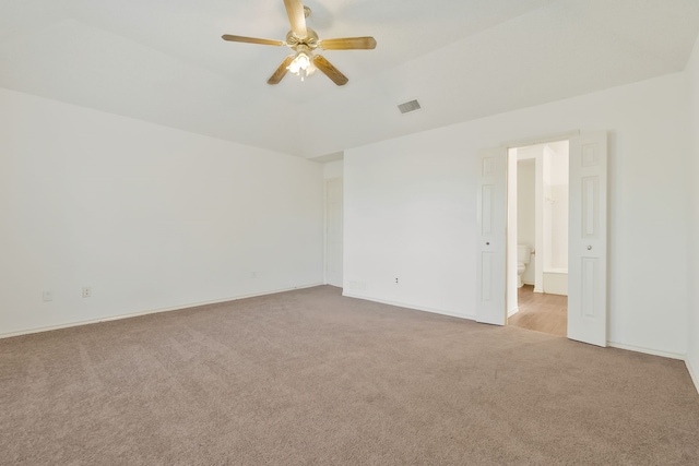 empty room featuring ceiling fan and light carpet