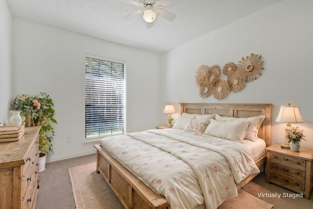 bedroom featuring light carpet and ceiling fan