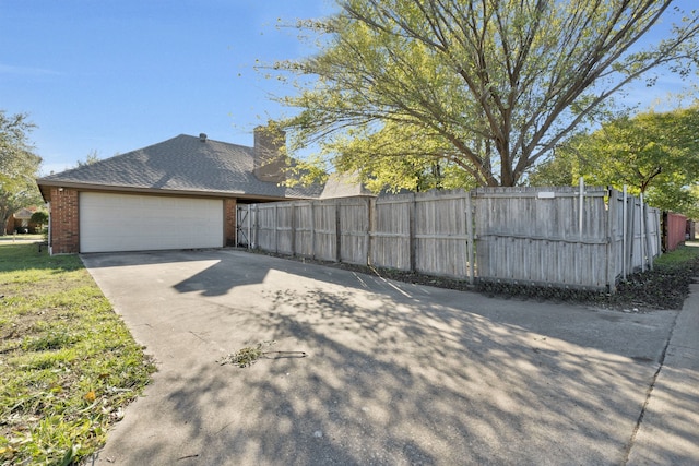 view of property exterior with a garage