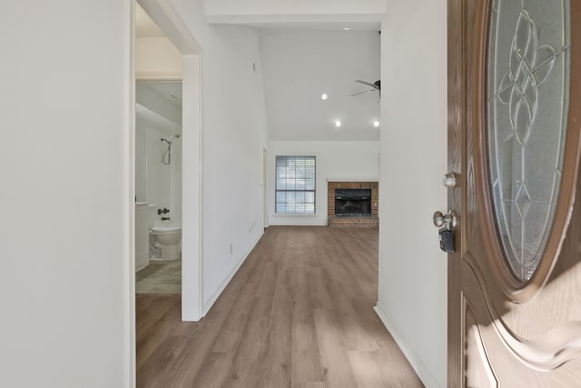 corridor with light hardwood / wood-style flooring