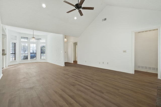 unfurnished living room with ceiling fan, high vaulted ceiling, and dark hardwood / wood-style floors