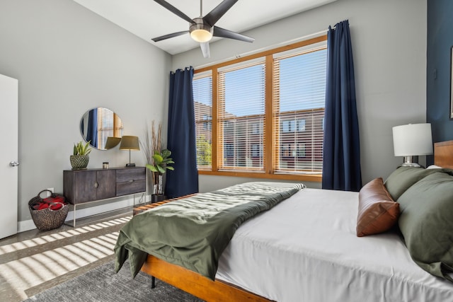 bedroom with ceiling fan and wood-type flooring