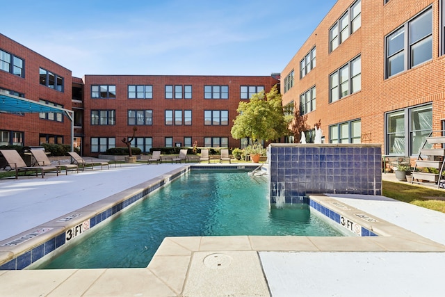 view of pool featuring pool water feature