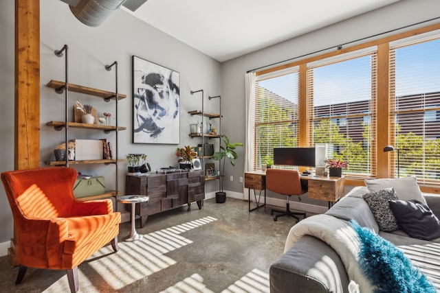 office area with a healthy amount of sunlight and concrete flooring