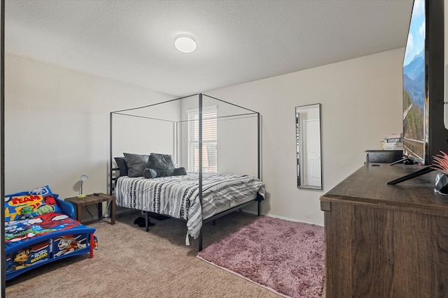 carpeted bedroom featuring a textured ceiling